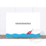 Glückwunschkarte mit Wasser- und Raketendesign, symbolisiert Erfolg und Glück.