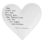 Herzförmiges Dekor mit Zitat über Herz und Augen, romantisch und inspirierend.