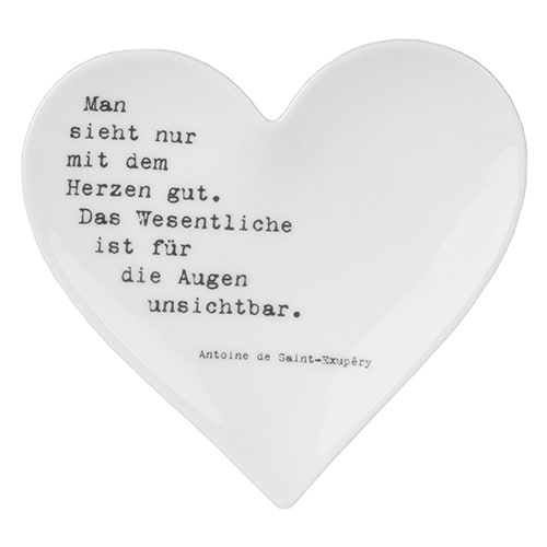 Herzförmiges Dekor mit Zitat über Herz und Augen, romantisch und inspirierend.