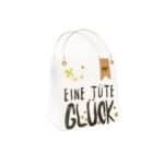 Einweg-Tragetasche mit "Eine Tüte Glück" Schriftzug und dekorativen Elementen, umweltfreundlich und.