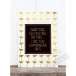Dairy free, gluten free, eat free sign with champagne glass pattern in gold on white background.