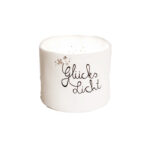 Glückliche Kerze mit "Gleiche Licht" Schriftzug und Blumenmotiven, ideal für gemütliche Beleuchtu.