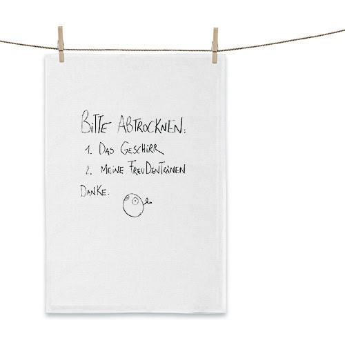Hängendes Handtuch mit handgeschriebener Notiz und Smileygrafik, an Wäscheleine befestigt.