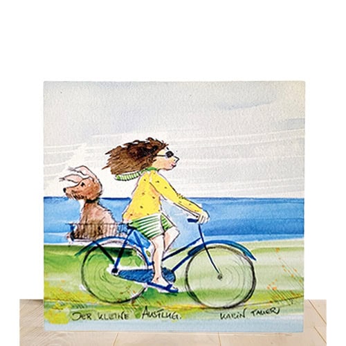 Abbildung eines Hundes und eines Mädchens, die zusammen Fahrrad fahren am Strand.