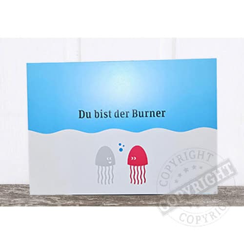 Einladungskarte mit dem Text "Du bist der Burner" und zwei lustigen Quallen in Grau und Rot.