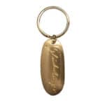 Eleganter goldener Schlüsselanhänger mit Gravur "Fokko 1883" für stilvollen Schmuck und persönliche.