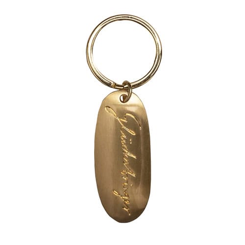 Eleganter goldener Schlüsselanhänger mit Gravur "Fokko 1883" für stilvollen Schmuck und persönliche.