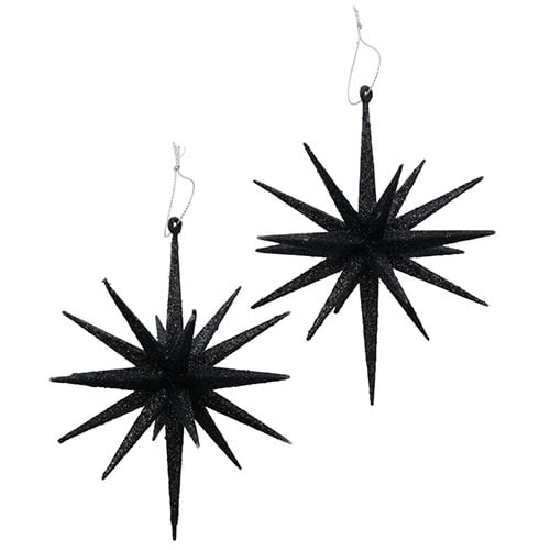 Glitzernde schwarze Weihnachtssterne als Dekoration für festliche Stimmung.