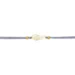 Elegantes Armband mit goldener Flamme und Perlen, feine Handwerkskunst.