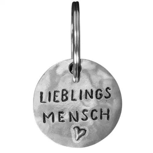 Schmuckanhänger mit Gravur 'Lieblingsmensch' und Herzsymbol.
