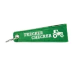 Grüner Schlüsselanhänger mit Traktor-Logo und 'Trecker Checker' Schriftzug.